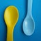 Empty plastic spoons for feeding babies and toddlers.