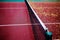 Empty plastic tennis court and net.