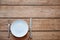 Empty plate with knife and fork on empty table