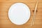 Empty plate and sushi chopsticks