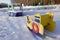 Empty playground for children on a frosty snowy winter day covered with snow without people. Russian playground. Maritime military