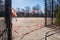 Empty playground without kids, off bound to children and parents. Closed off with striped red and white barrier tape. Forbidden to