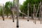 Empty playground of sand ground, wooden poles and ropes