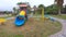 The empty playground with slide and swing no people