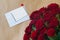 Empty postal envelope with bouquet of roses flowers