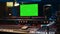 Empty professional studio showing greenscreen layout on monitor