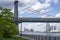 An empty promenade along East River in lower Manhattan with a view of Williamsburg Bridge