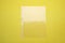 Empty punched pocket on yellow background, top view