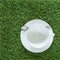 Empty pure white cup on the grasses background