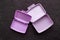 Empty purple lunch boxes, top view. Plastic container for food