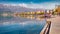 Empty quay in Pogradec town with snowe mountain range on background