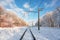 Empty railroad with electric mainline in winter forest