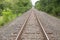 An empty railroad track in the country