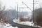 Empty railroad turn in winter fog