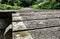 Empty raised timber footpath seen at the entrance to a distant nature reserve.