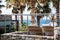 Empty rattan chairs on a resort`s balcony facing the sea