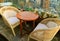 Empty Rattan Chairs with Round Table at the Rooftop Terrace