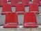 Empty red bleacher seats