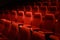 Empty red cinema chairs. Dark tone