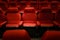 Empty red cinema chairs. Dark tone