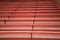 EMPTY RED WOODEN BLEACHERS