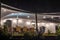 Empty restaurant terrace with tables and rattan chairs in evening. Tanzania, Africa