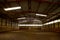 Empty riding hall with sandy covering without riders as an equestrian background