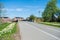 empty road and bridge, beautiful blossoming daffodils and historical architecture