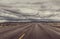 Empty road on cloudy day