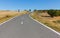 Empty road among the fields