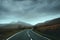 Empty road heading towards the mountains of Snowdonia on a stormy winters day
