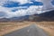 Empty road through HImalayas mountains in Ladakh, Northern India.