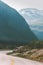 Empty road and mountains landscape Travel summer vacations