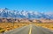 Empty road near Lone Pine with rocks of the Alabama Hills and the Sierra Nevada in the background, Inyo County, California, United