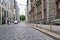 Empty road with paving stones and curb