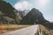 Empty road and rocky mountain tunnel landscape