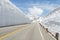 Empty road and snow wall at japan alps tateyama kurobe alpine