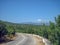 Empty road in the southern hilly-mountainous area on a hot summer day