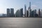 Empty road surface floor with city landmark buildings of Shanghai Skyline