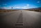 Empty road towards distant horizon in western US