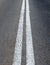 An empty road with white double line road marking