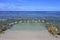 Empty rock pool on a coral reef in Rarotonga Cook Islands