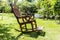 Empty rocking chair over grass