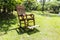 Empty rocking chair over grass