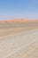 Empty rocky desert road to Erg Chebbi in the Moroccan Sahara, Africa