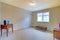 Empty room with antique bench and cabinet