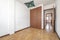 empty room with brown wooden built in wardrobe with green fabric