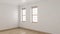 Empty Room Design with Single Hung Windows and Parquet Flooring
