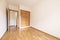 Empty room with French oak parquet floors with matching built-in wardrobe