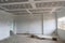 Empty room interior with gypsum board ceiling at construction si